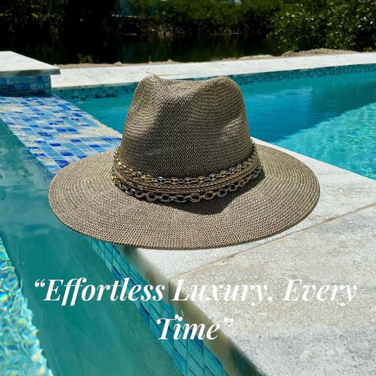 Mixed metal chain wide brim sun hat for women, luxury Panama style with gold and silver accents, perfect for beach or resort wear.
