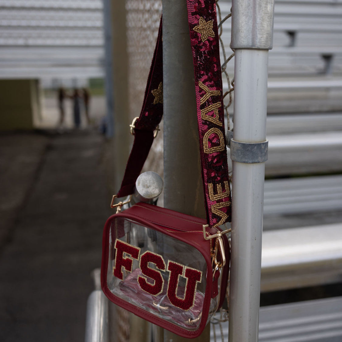 Red bag with 'FSU' on a metal railing