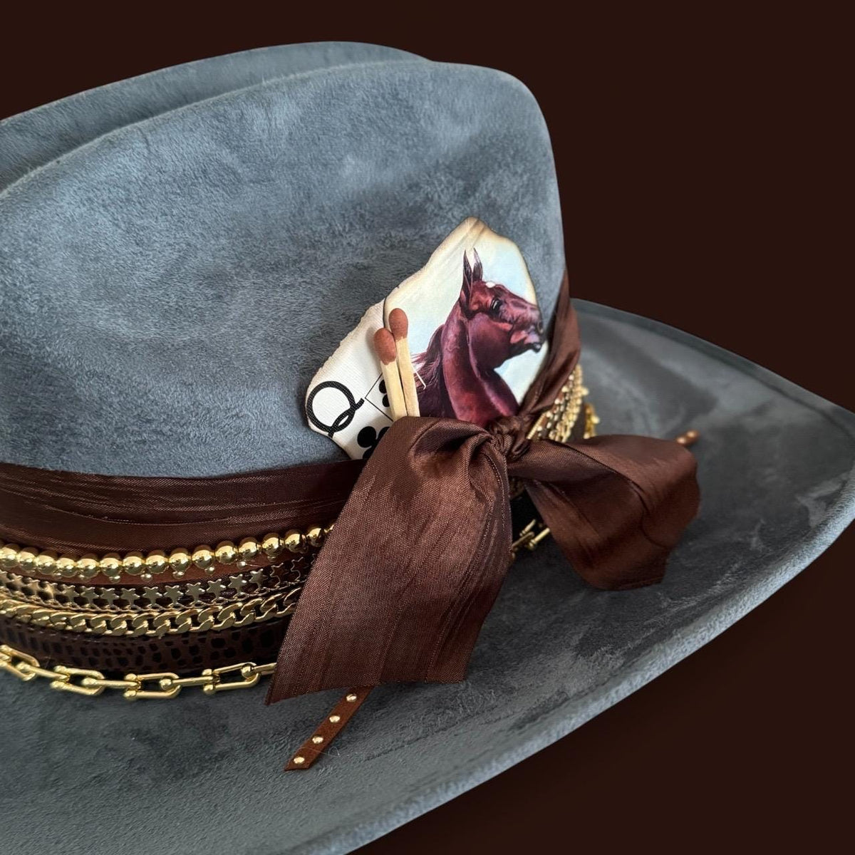 Blue cowboy hat with 18k gold jeweled accents, Western style, crafted by Sunkissed by Chrissy, perfect for rodeo or country concerts