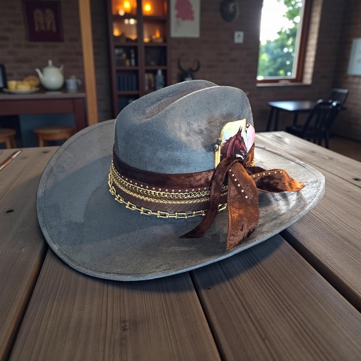 Blue cowboy hat with 18k gold jewelry accents, custom rodeo style, western glam design, by Sunkissed by Chrissy.
