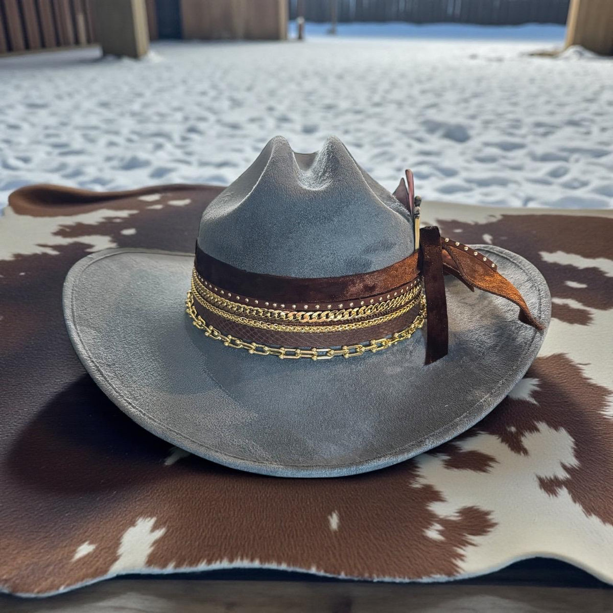 Blue cowboy hat with 18k gold jewels, custom rodeo style, Sunkissed by Chrissy, perfect for country concerts and western fashion.