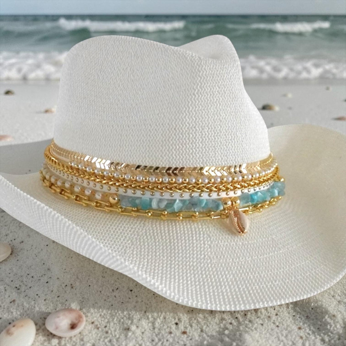 White cowboy hat by Sunkissed by Chrissy, perfect for beach bachelorette and boho destination wedding, featuring a blue accent.