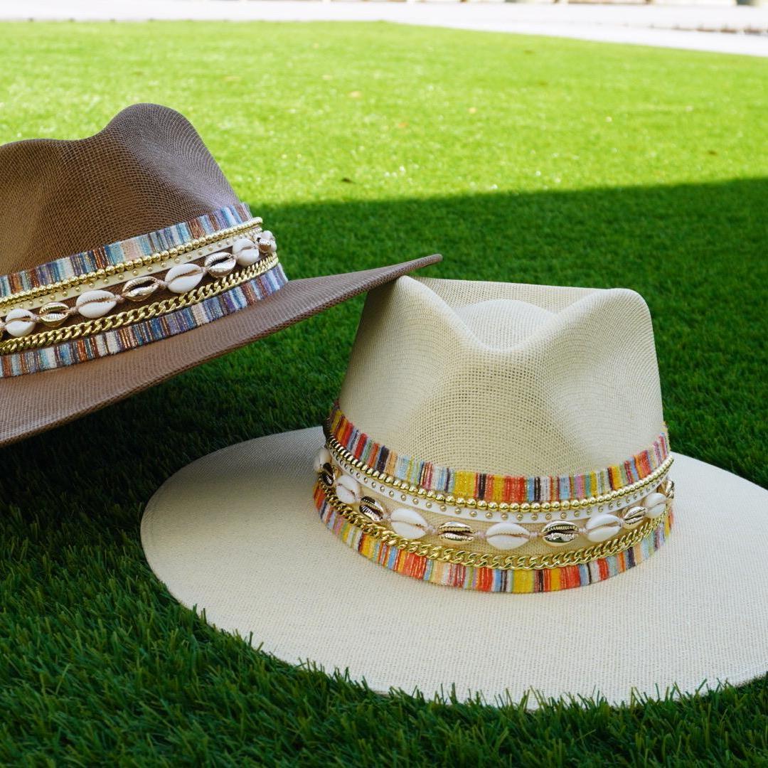 Women's waterproof wide brim boater hat by Sunkissed by Chrissy with straw material, jute band, gold accents, perfect for beach and resort wear.