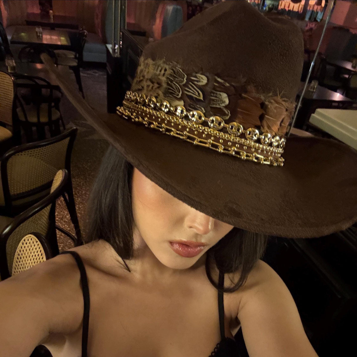 Sunkissed by Chrissy feather cowboy hat for women, Western style with decorative feathers, perfect for country rodeo or concert outfits.