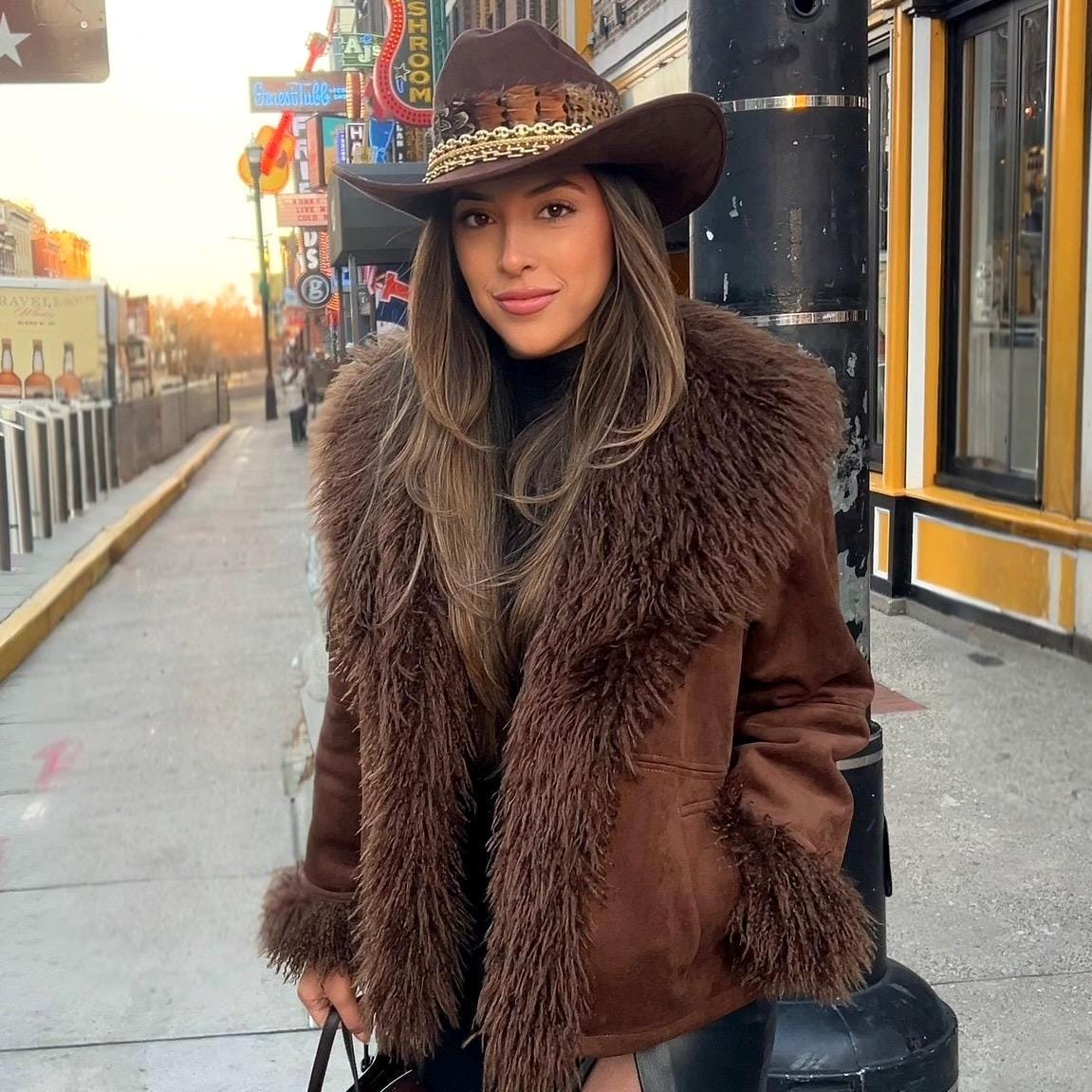 Sunkissed by Chrissy feather cowboy hat for women, stylish western fashion accessory, perfect for rodeo, country events, or ranch weddings.