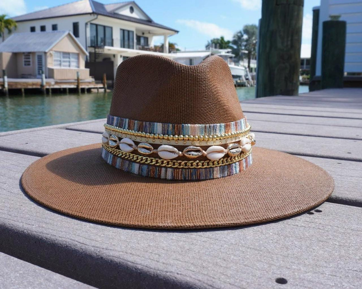 Women's wide brim boater hat by Sunkissed by Chrissy with straw material, jute band, gold accents, perfect for beach and resort wear.