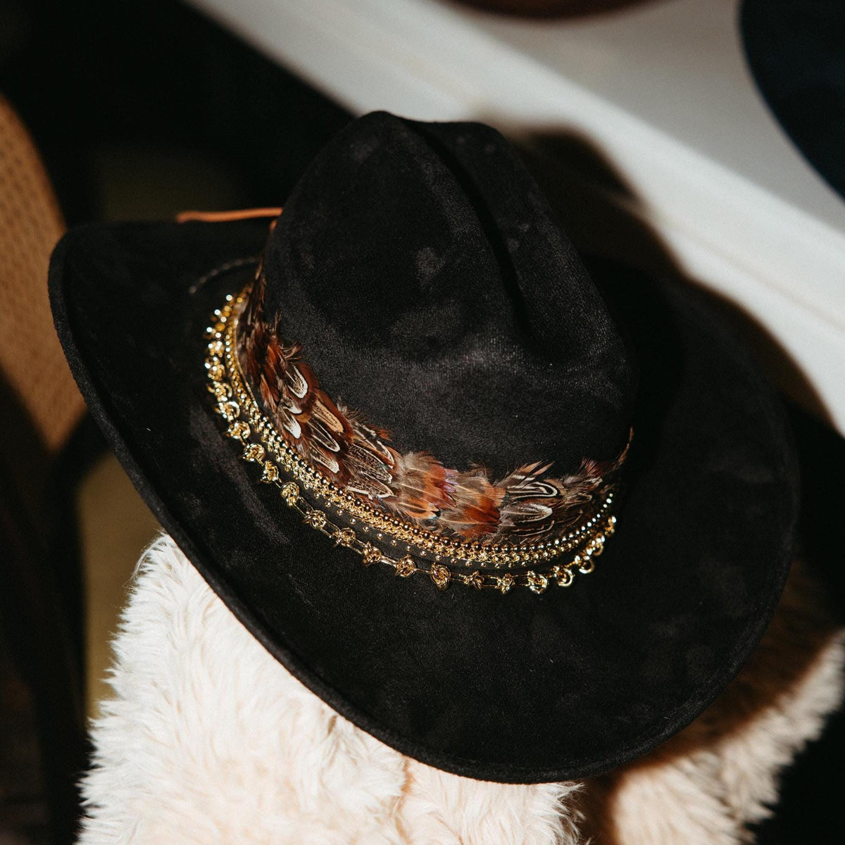 Sunkissed by Chrissy feather cowboy hat for women, Western country fashion accessory, perfect for rodeo, concerts, or ranch weddings.