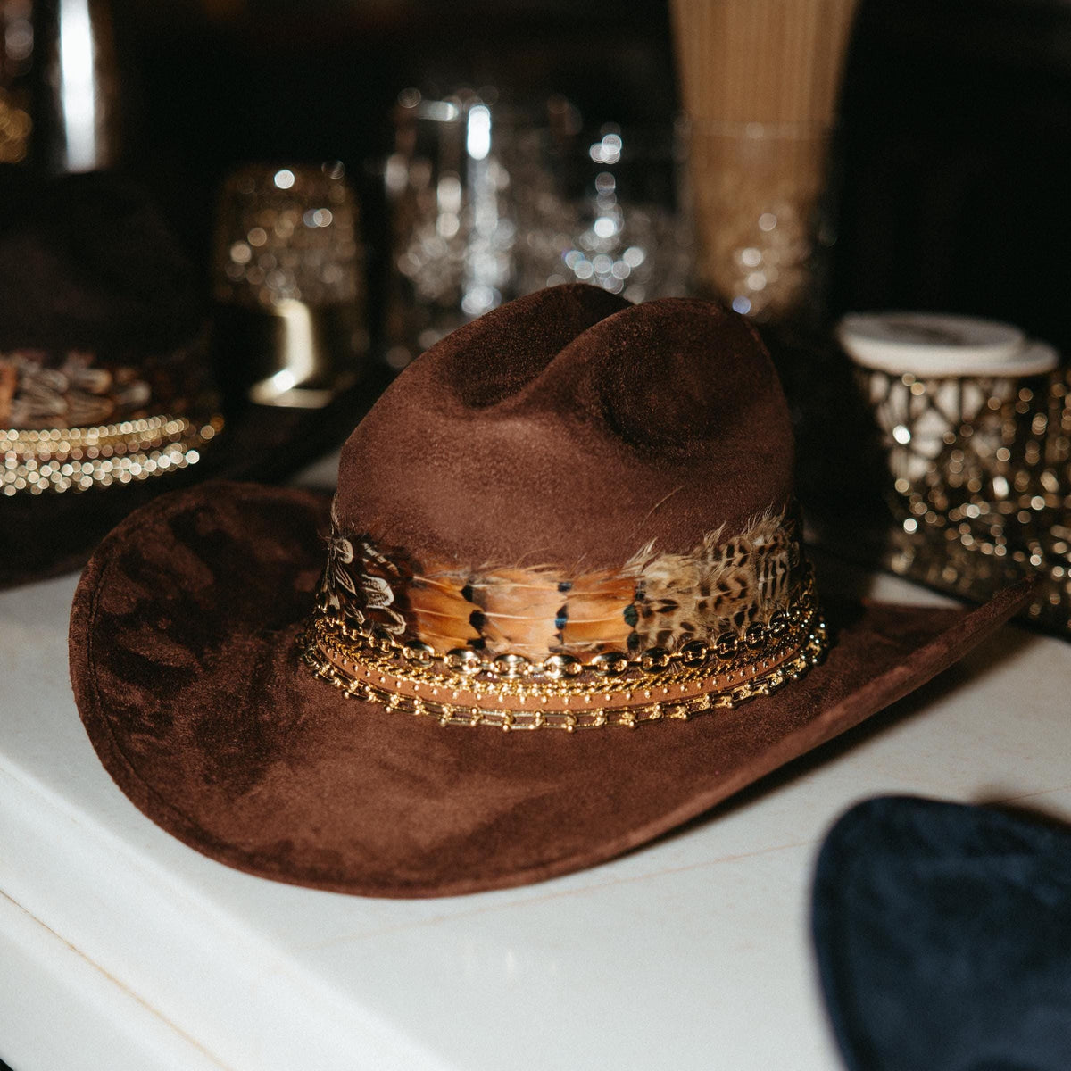 Sunkissed by Chrissy feather cowboy hat for women, Western style, perfect for rodeo, country fashion, or music events.