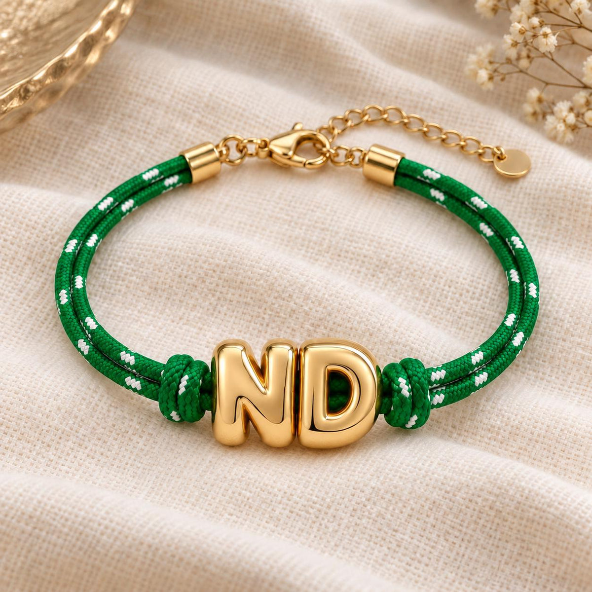 Personalized paracord bracelet with gold initials, adjustable Gameday wristband by Sunkissed by Chrissy, featuring colorful European-style design.