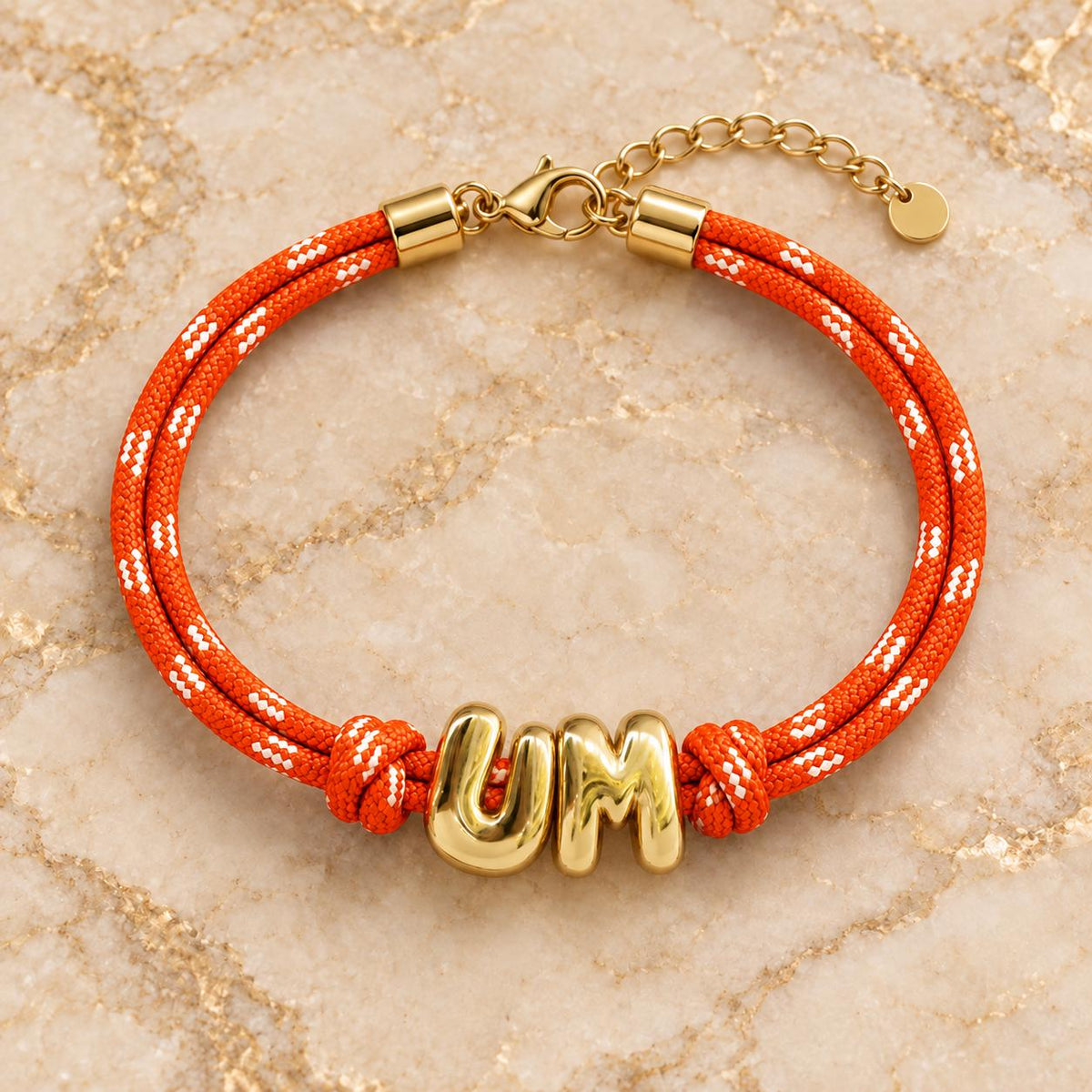 Personalized paracord bracelet with gold initials from Sunkissed by Chrissy, adjustable Gameday wristband in European style.