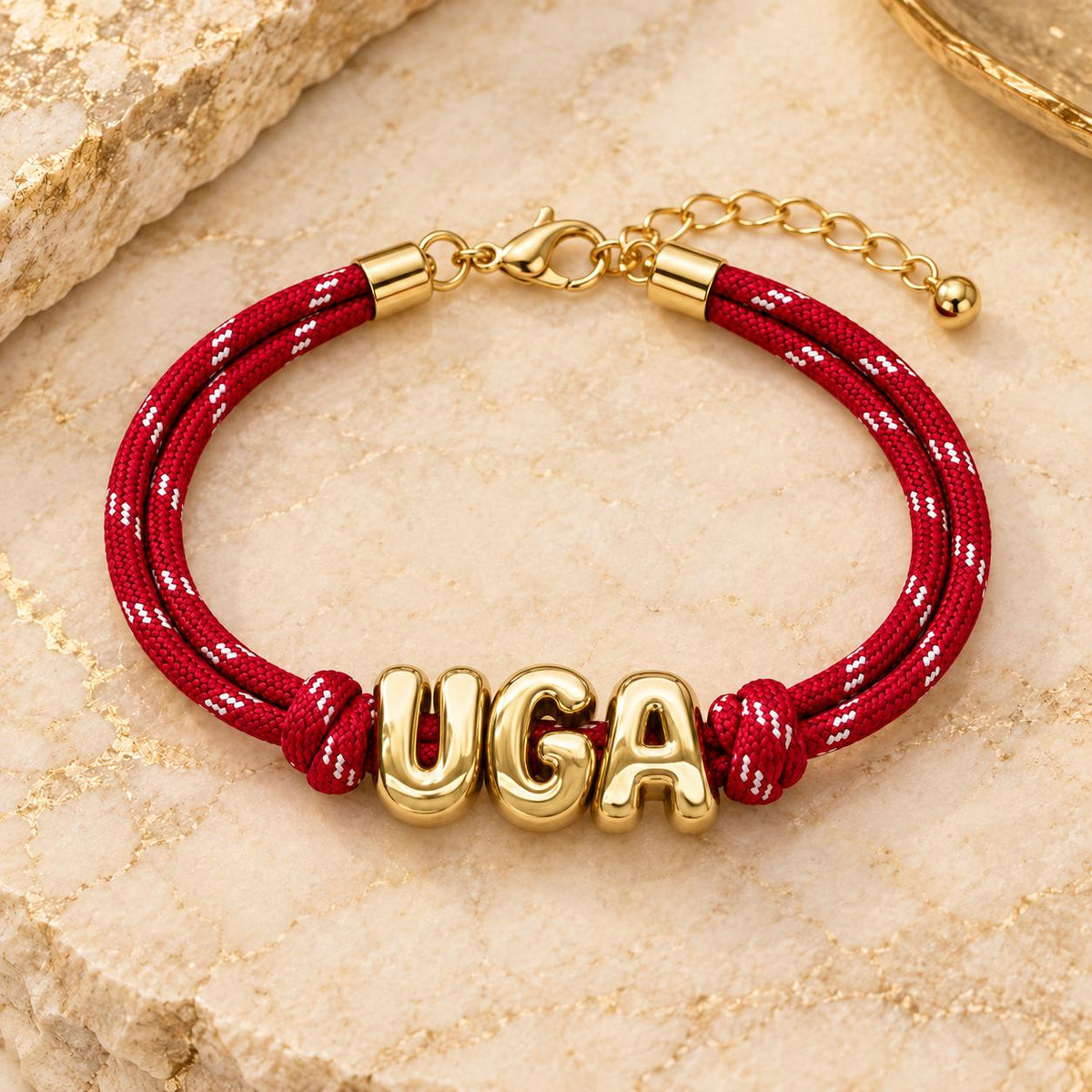 Personalized paracord bracelet with gold initials, adjustable Gameday wristband by Sunkissed by Chrissy featuring European design.