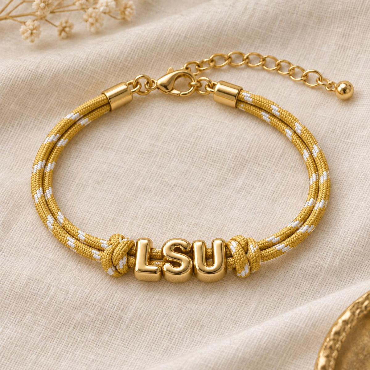 Personalized Sunkissed by Chrissy paracord bracelet with gold initials, adjustable Gameday wristband, featuring European-style design.