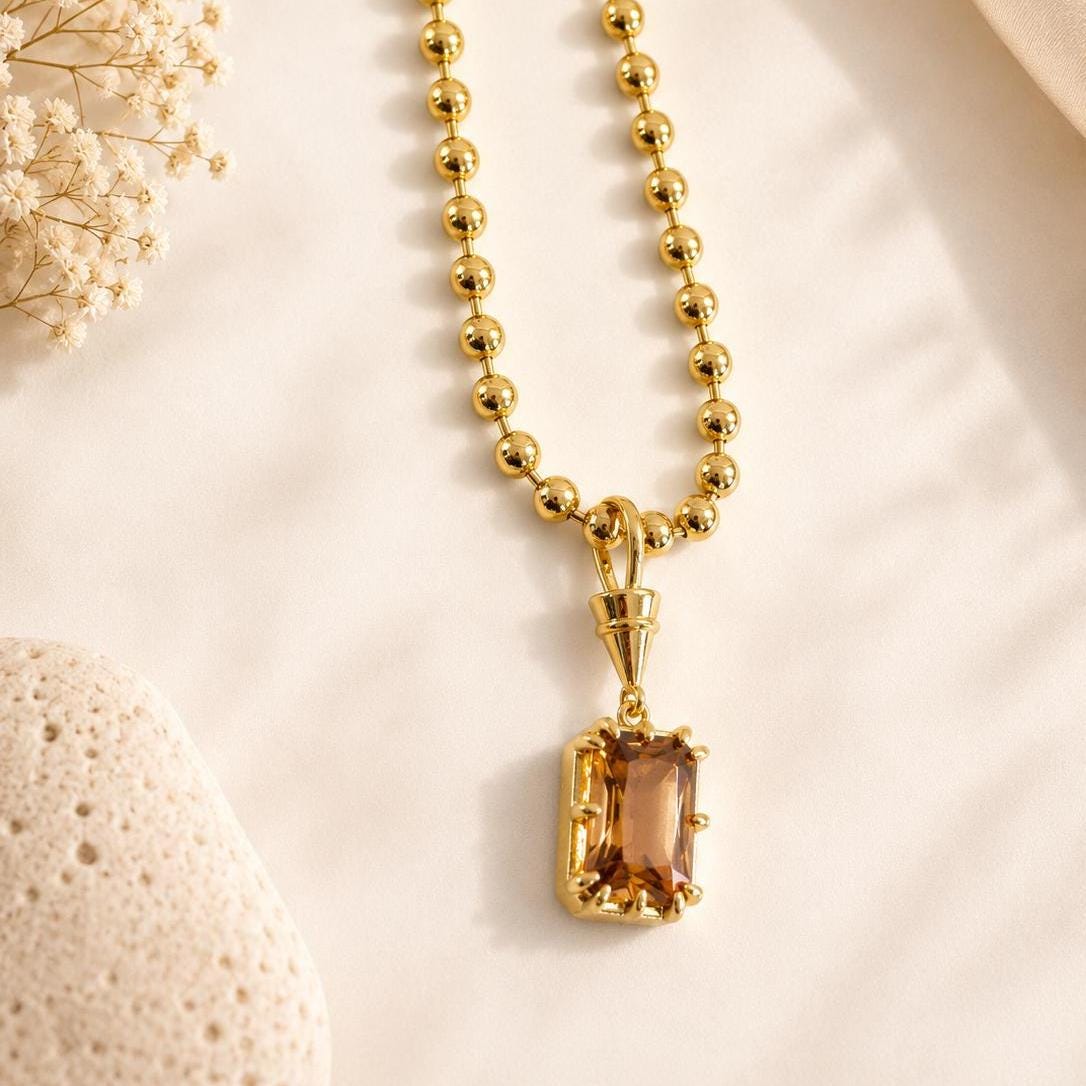Dainty gold gemstone pendant necklace with solitaire birthstone, elegant layered jewelry by Sunkissed by Chrissy for everyday wear