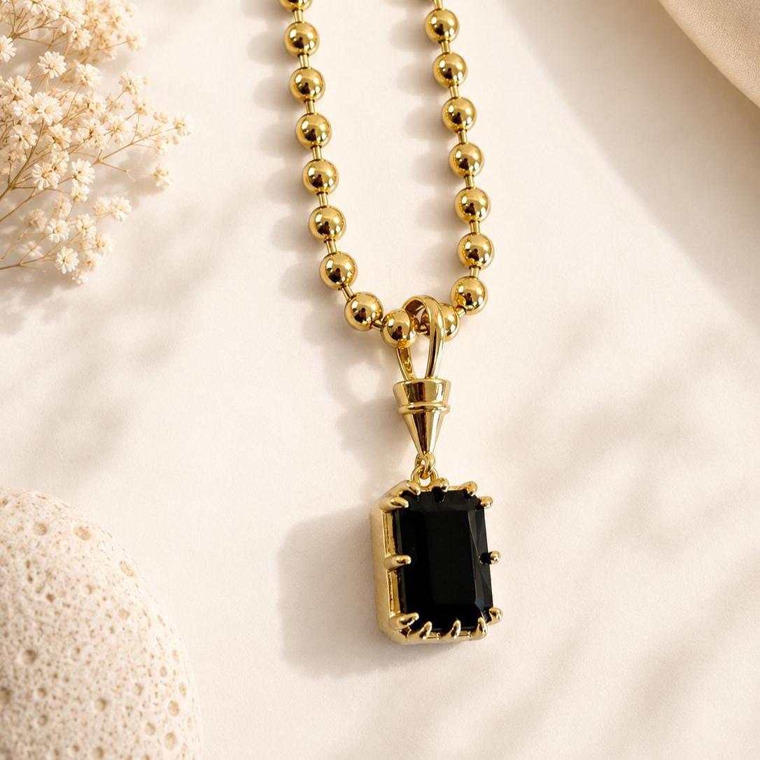 Gold gemstone pendant necklace by Sunkissed by Chrissy featuring a solitaire birthstone, dainty elegant jewelry for wedding or everyday wear.