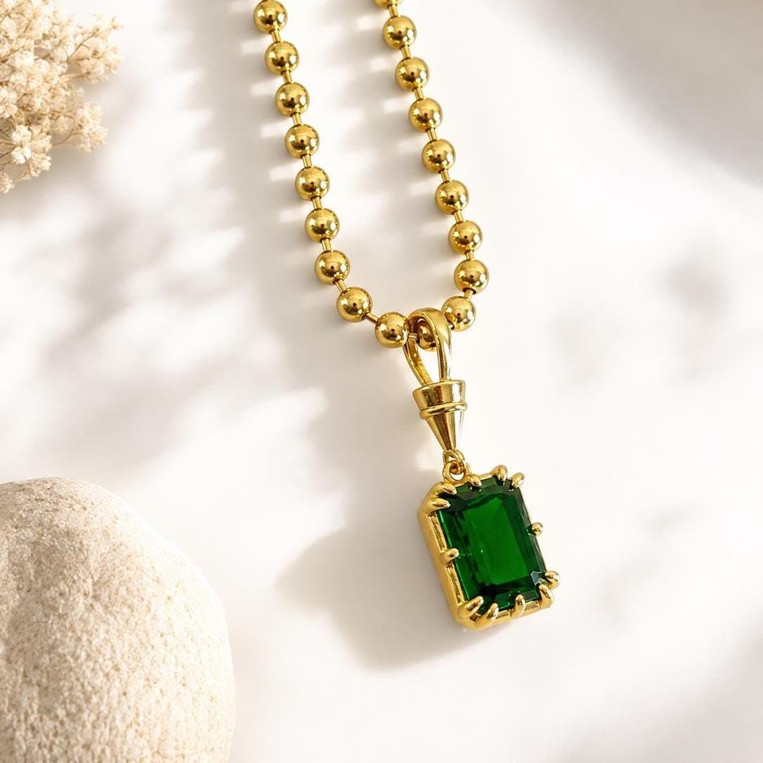 Gold gemstone pendant necklace with a solitaire birthstone, dainty and elegant jewelry by Sunkissed by Chrissy, perfect for layering.