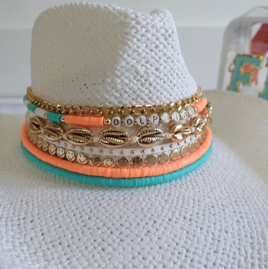 Sunkissed by Chrissy Dolphins cowboy hat with jeweled dolphins, visor style, featuring Miami Dolphins logo and decorative fins.