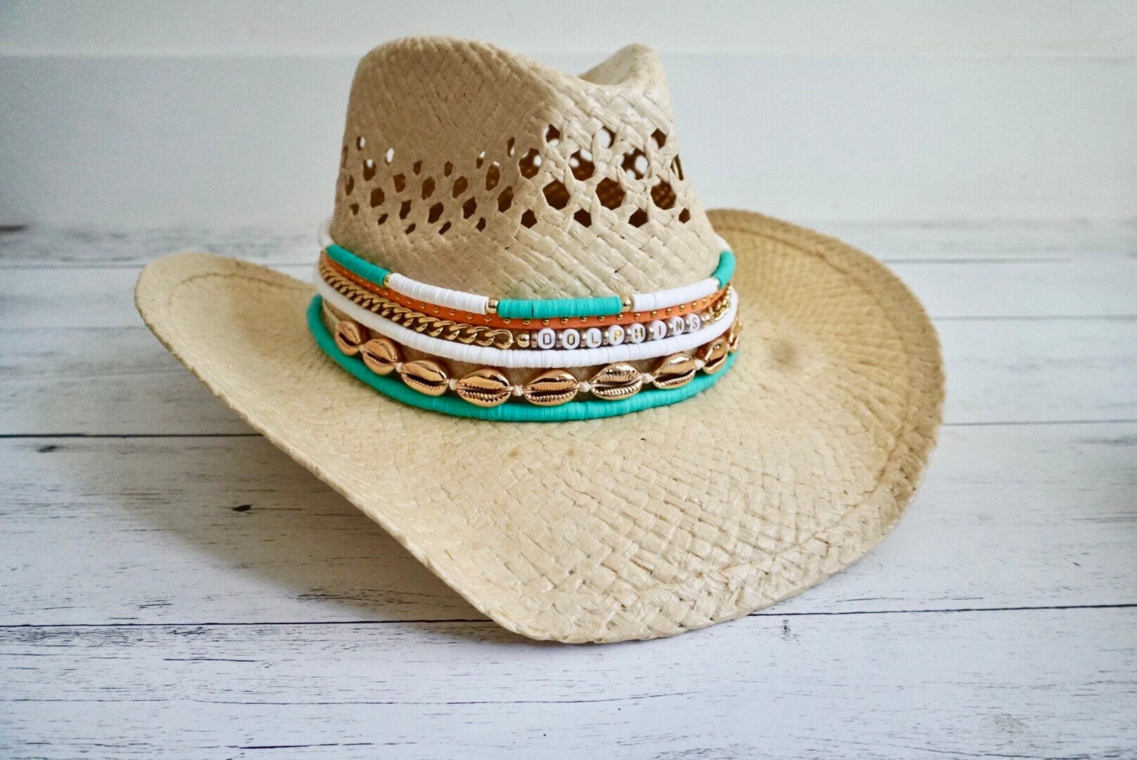 Sunkissed by Chrissy Miami Dolphins cowboy hat with jeweled dolphin and fins design, perfect for Dolphins fans.