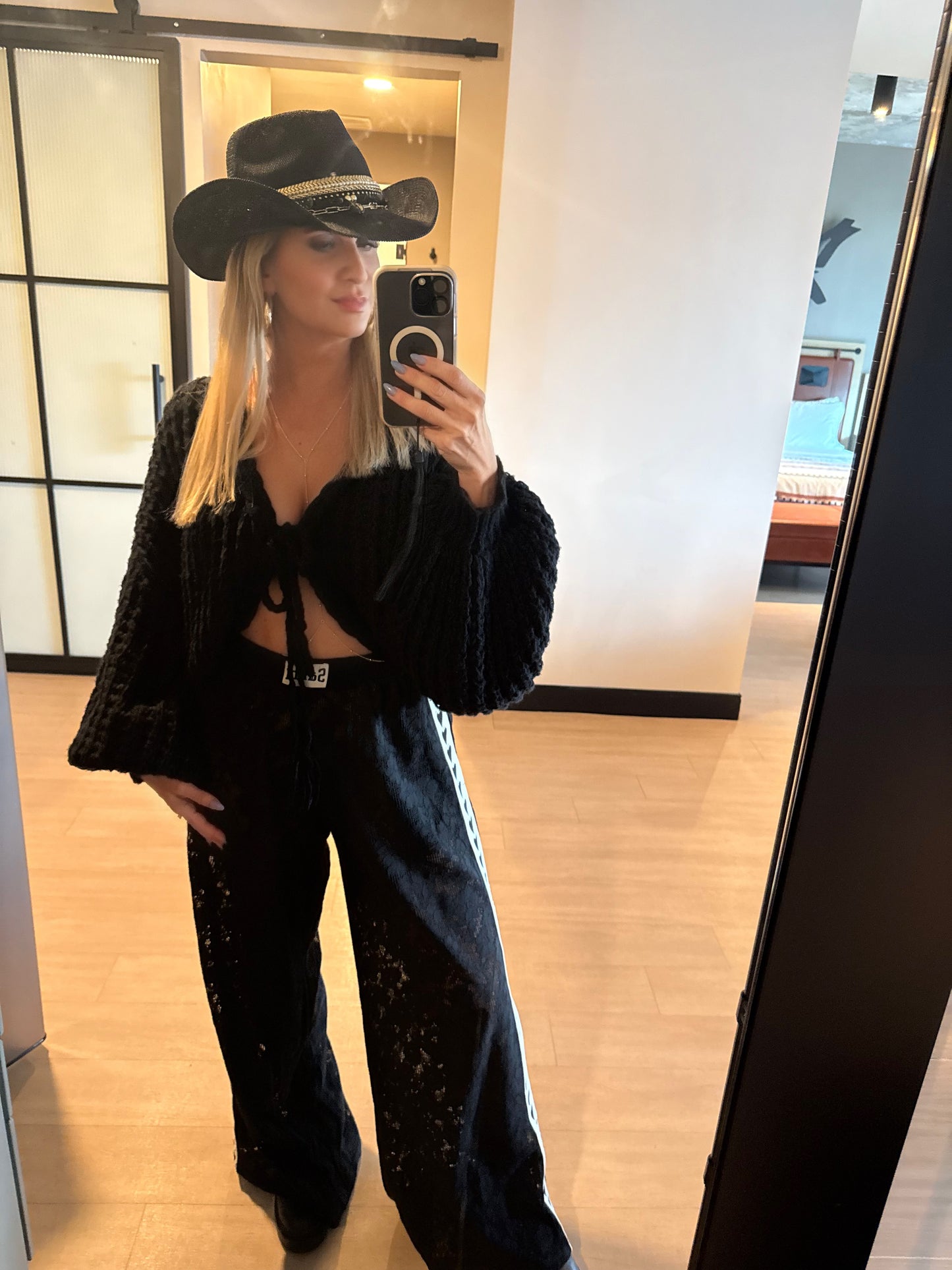 Black straw Western festival hat with jeweled accents, gold and shell details, perfect for beach or upscale vacation style.
