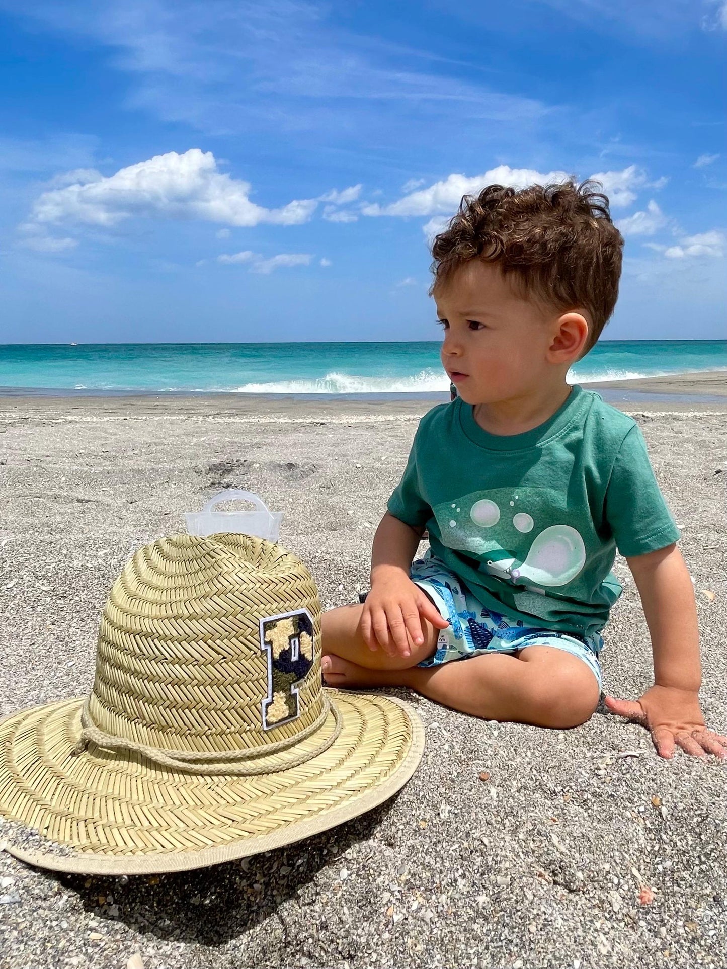 Personalized Sunkissed by Chrissy kids straw sun hat with initial embroidery, perfect for toddlers at the beach or as a birthday gift.