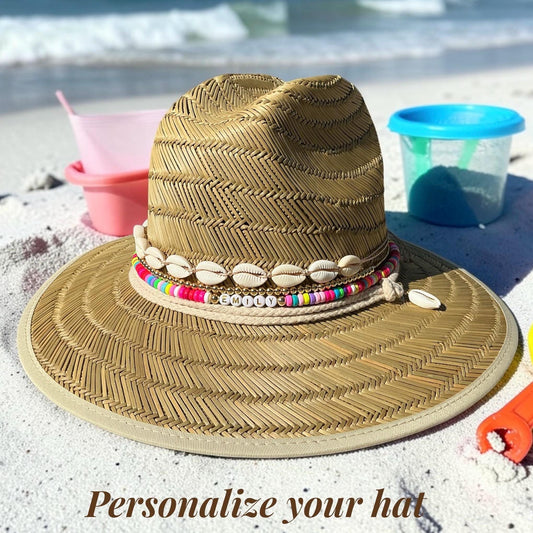 Personalized toddler sun hat by Sunkissed by Chrissy with beads and cowrie shells, perfect for girls’ summer beach outings.