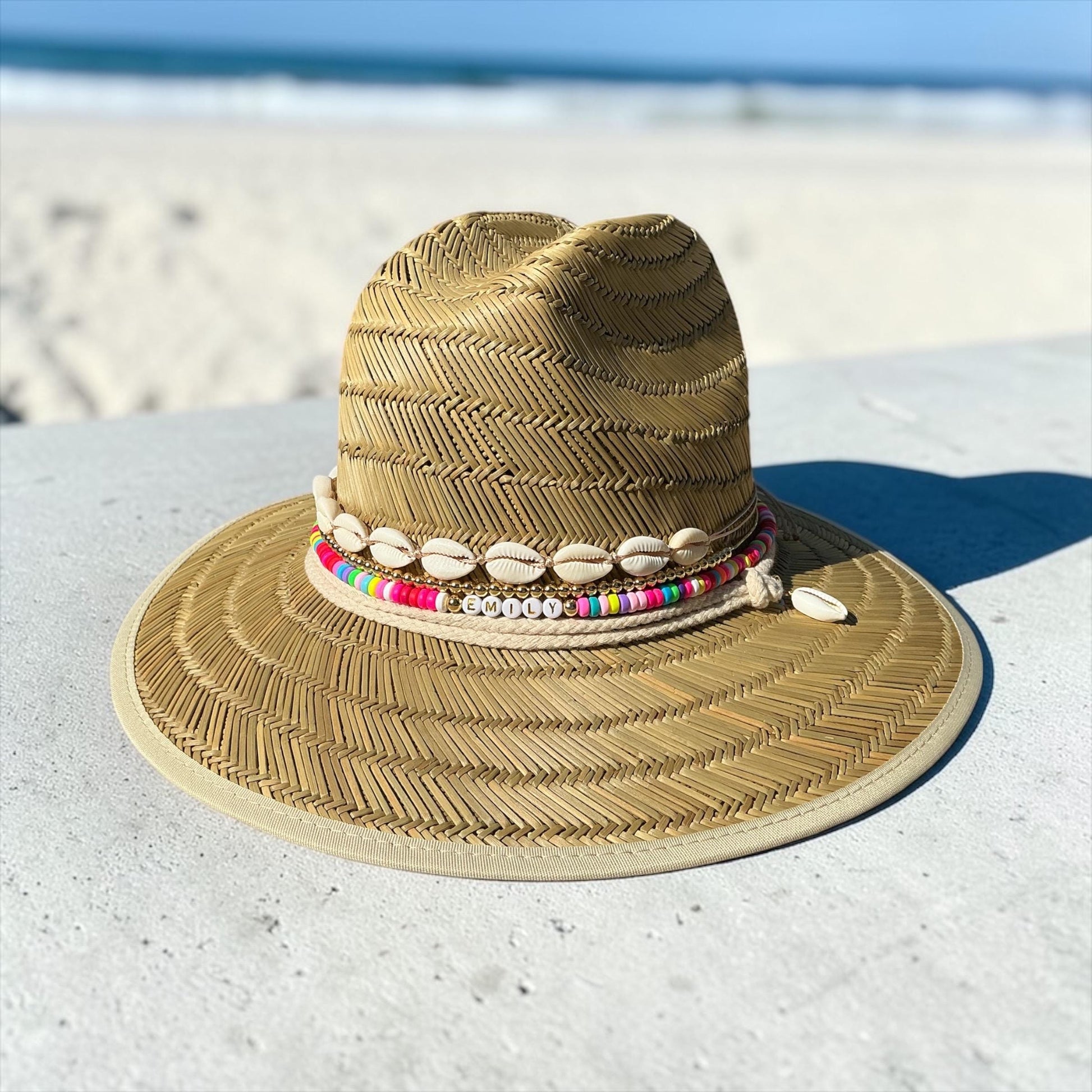 Personalized toddler sun hat with beads and cowrie shells, summer straw hat for girls, by Sunkissed by Chrissy.