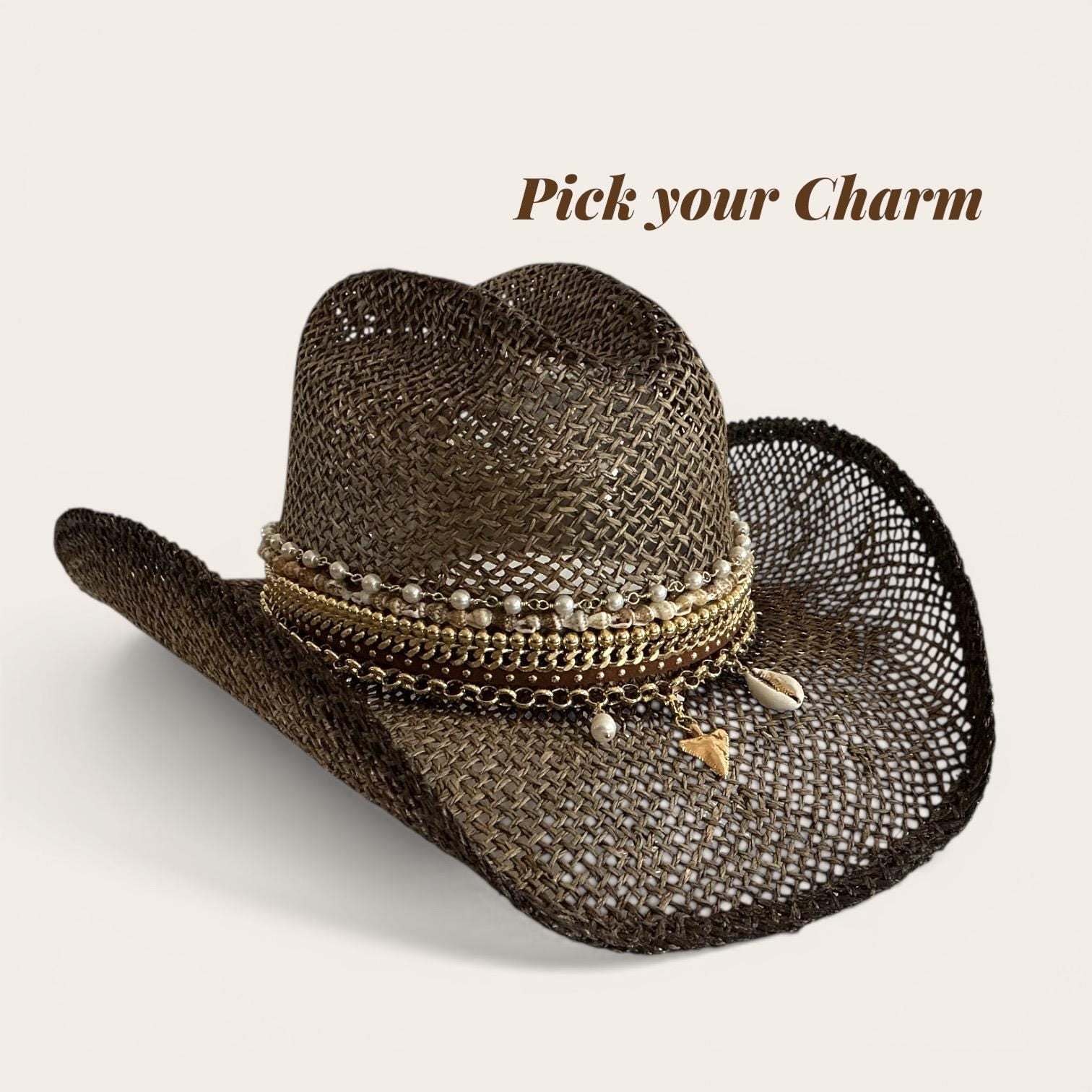 Brown straw cowboy hat with beaded seashell charm, boho style, handmade coastal cowgirl hat for summer festivals and beach vacations.