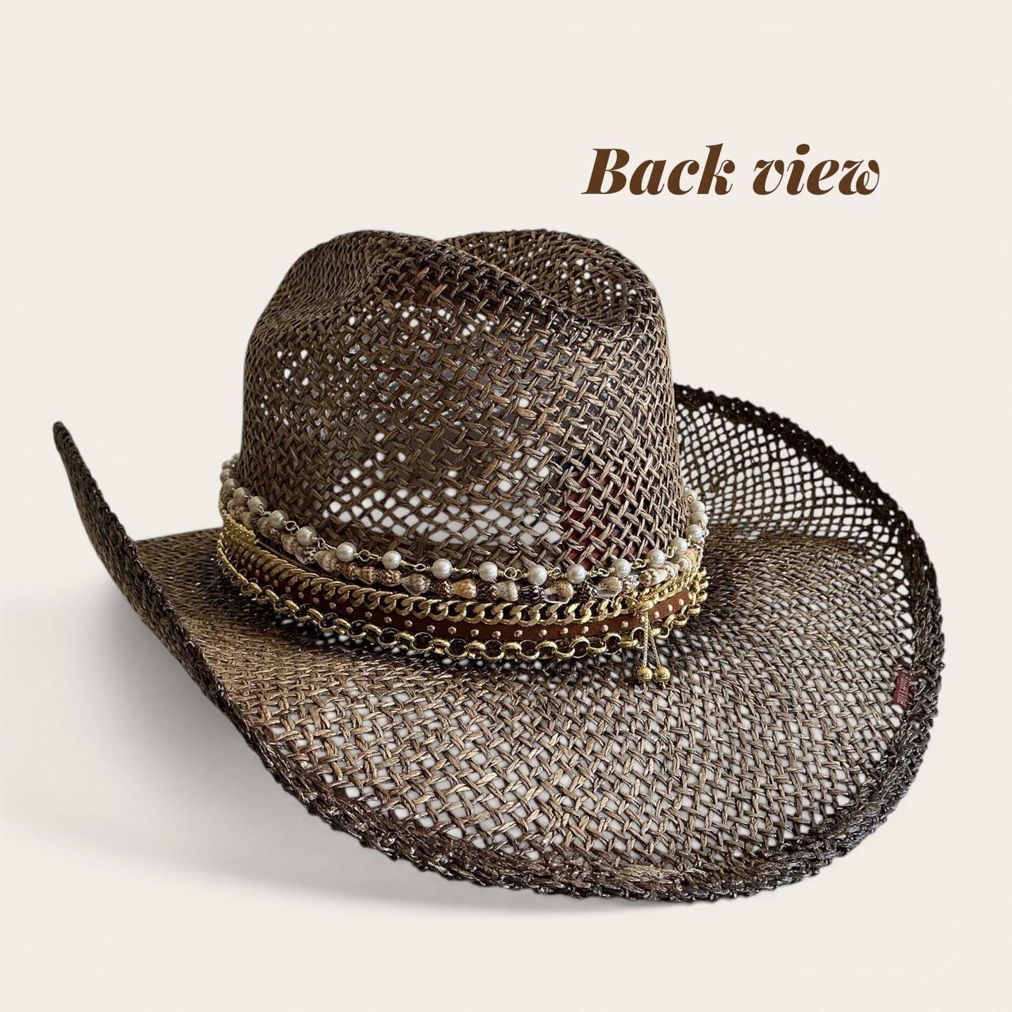Brown straw cowboy hat with beaded seashell charm, boho style, perfect for summer festivals and beach resort vacations.