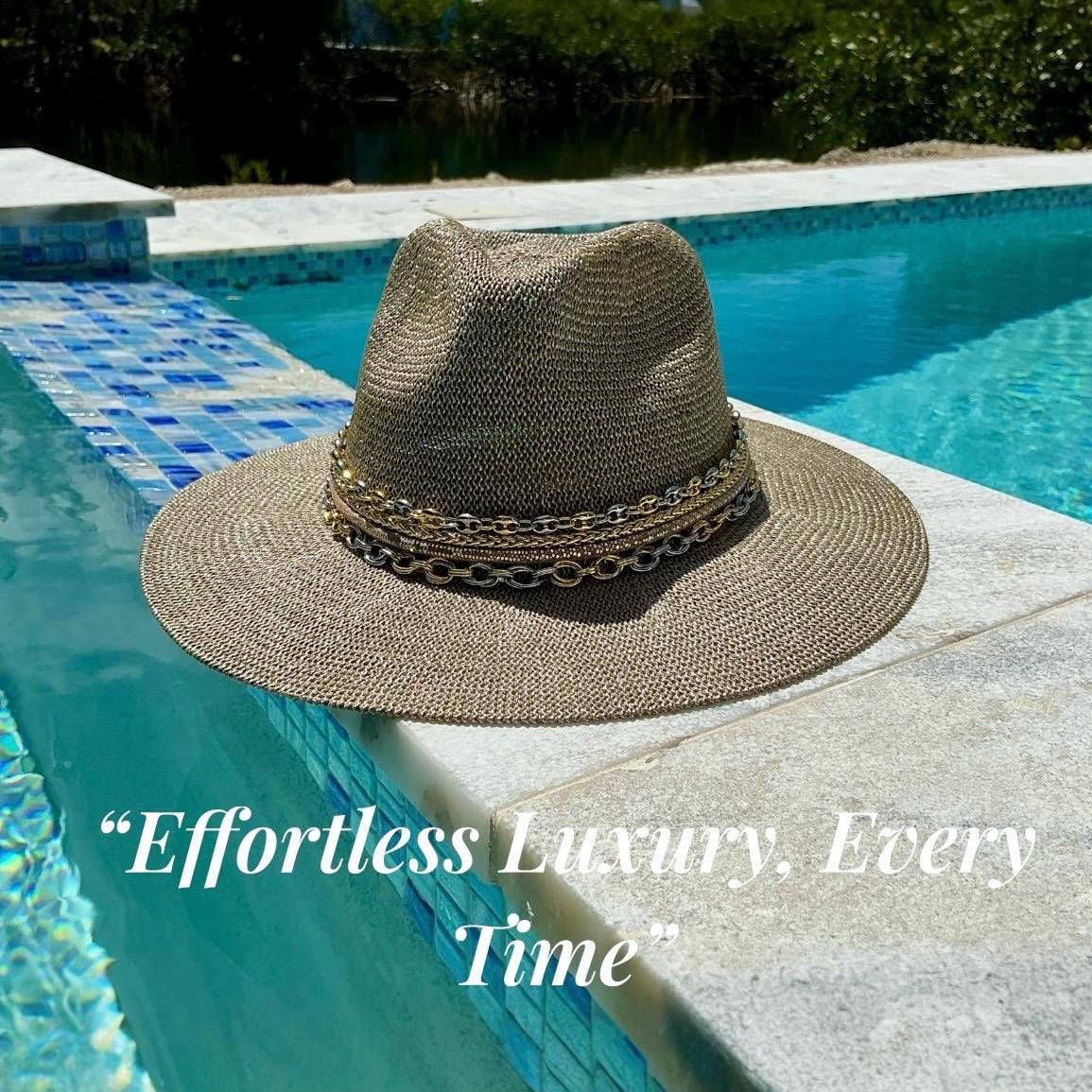 Mixed metal chain wide brim sun hat for women, luxury Panama style with gold and silver accents, perfect for beach or resort wear.
