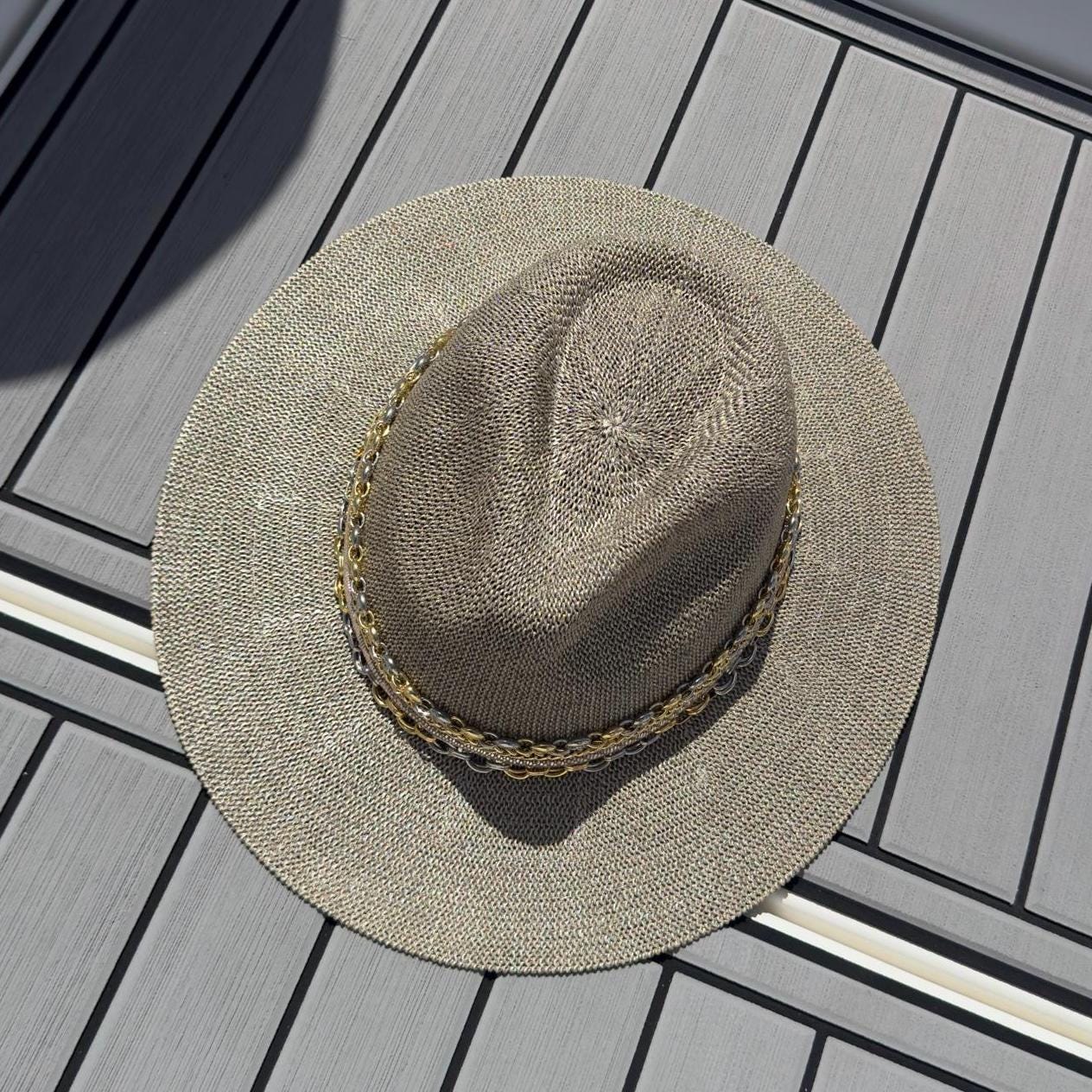 Mixed metal chain wide brim sun hat for women, luxury Panama style by Sunkissed by Chrissy, perfect for beach and resort wear.