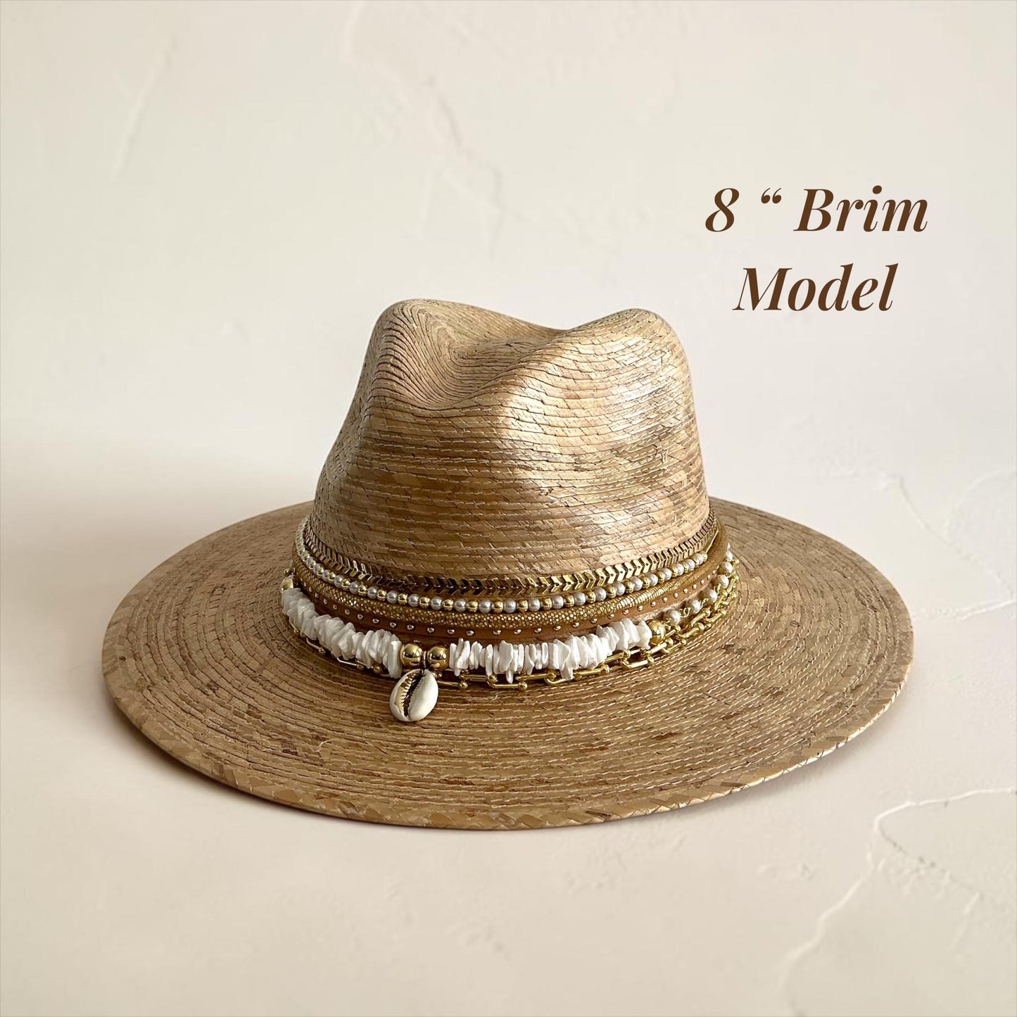 Sunkissed by Chrissy luxury Panama hat with wide brim, gold chain, pearls, and shells, perfect for beach and resort vacation wear.