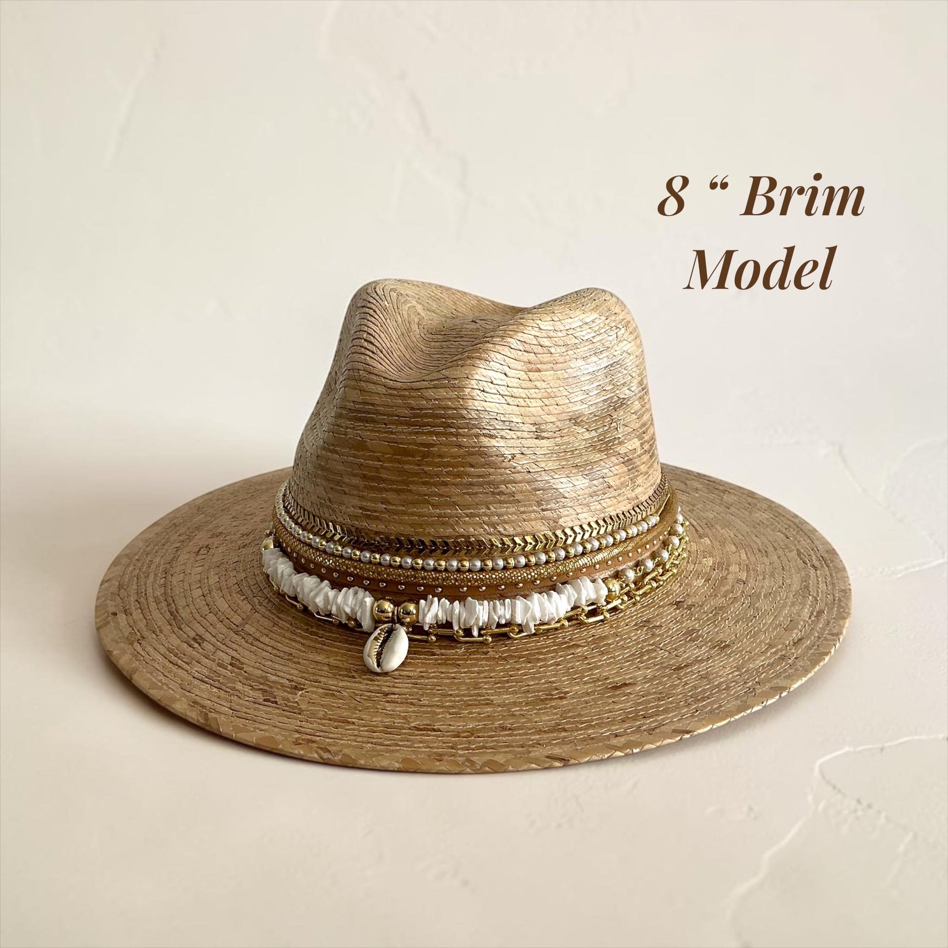 Sunkissed by Chrissy luxury Panama hat with wide brim, gold chain, pearls, and shells, perfect for beach and resort vacation wear.