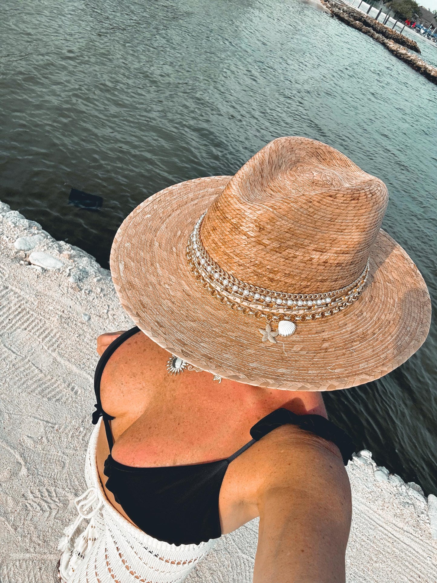 Sunkissed by Chrissy luxury Panama hat with gold chain, pearls, and shells, perfect for beach vacations and summer resort wear.