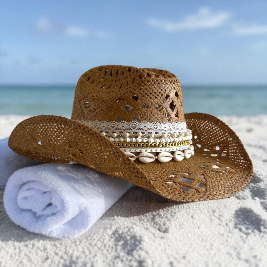 Women’s luxury straw cowboy hat with wide brim, shell trim, boho coastal style, perfect for summer beach and vacation wear.
