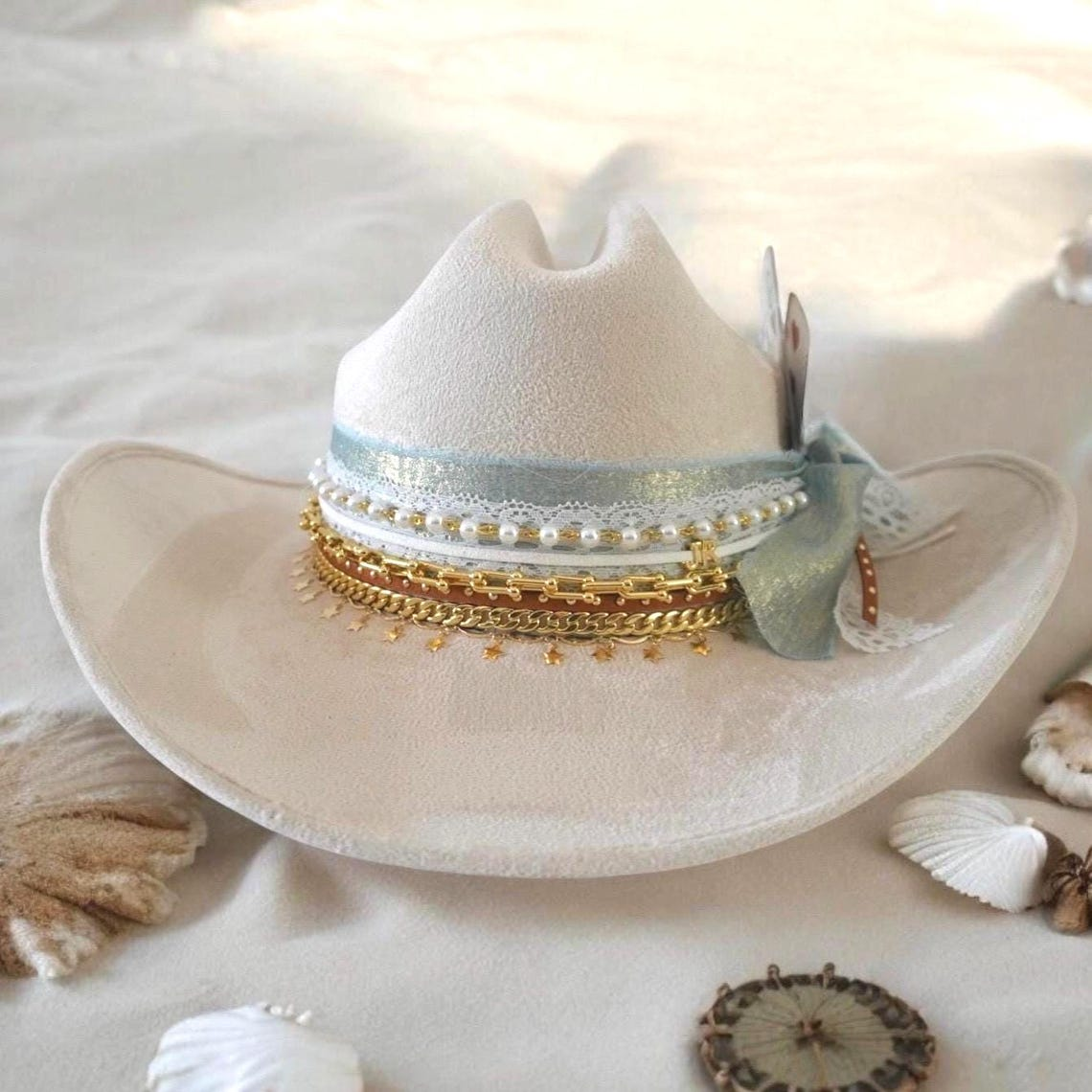 Custom coastal cowgirl hat by Sunkissed by Chrissy featuring shabby chic style with jeweled western design, perfect for beach or bachelorette events.