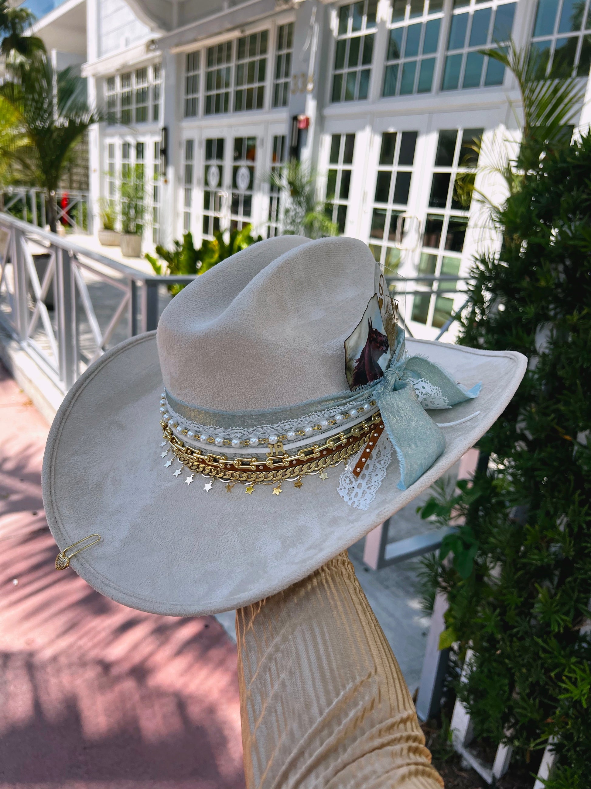 Custom coastal cowgirl hat by Sunkissed by Chrissy featuring shabby chic style, jeweled western design, perfect for bachelorette beach occasions.