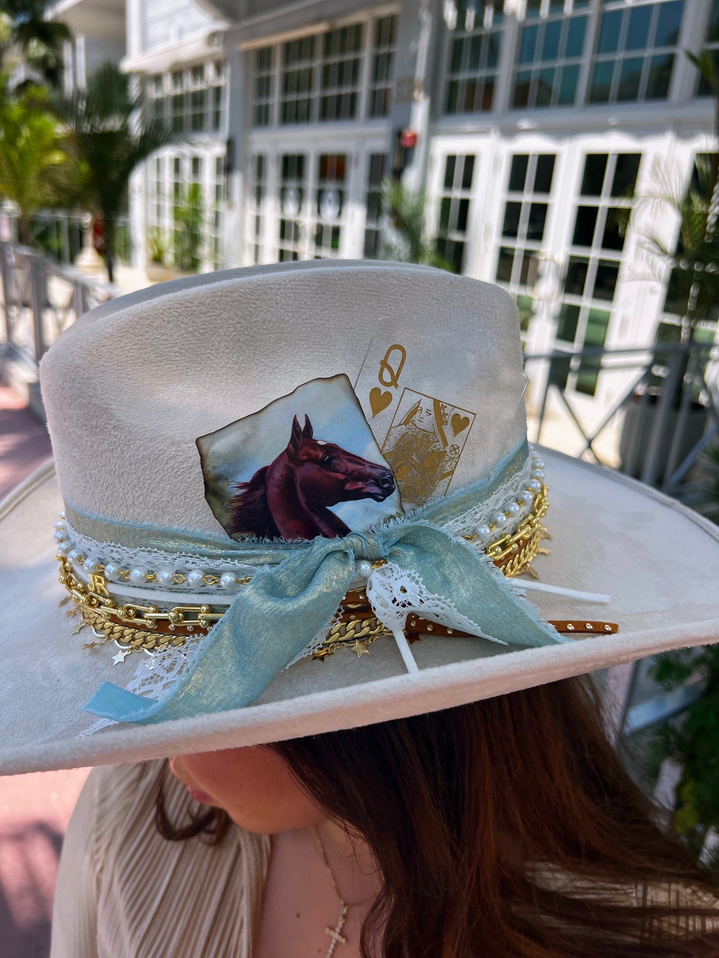 Custom coastal cowgirl hat by Sunkissed by Chrissy featuring shabby chic style with jeweled western accents and personalized detailing.