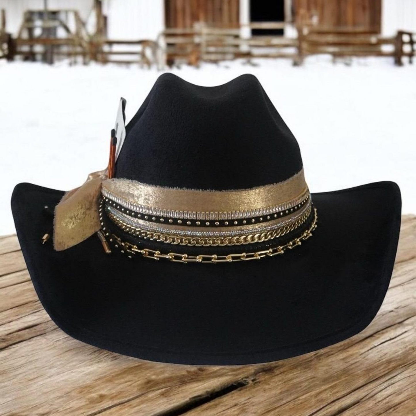 Black cowboy hat with jeweled embellishments, custom western style by Sunkissed by Chrissy, perfect for rodeo or country-themed outfits.