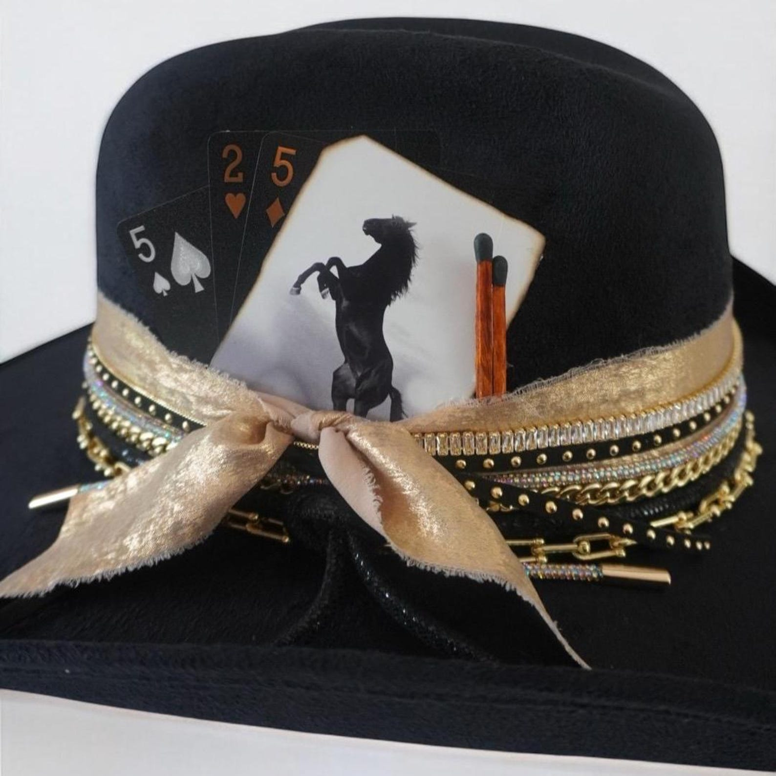 Black cowboy hat with jeweled embellishments, custom western style by Sunkissed by Chrissy, perfect for country concerts and rodeo outfits.