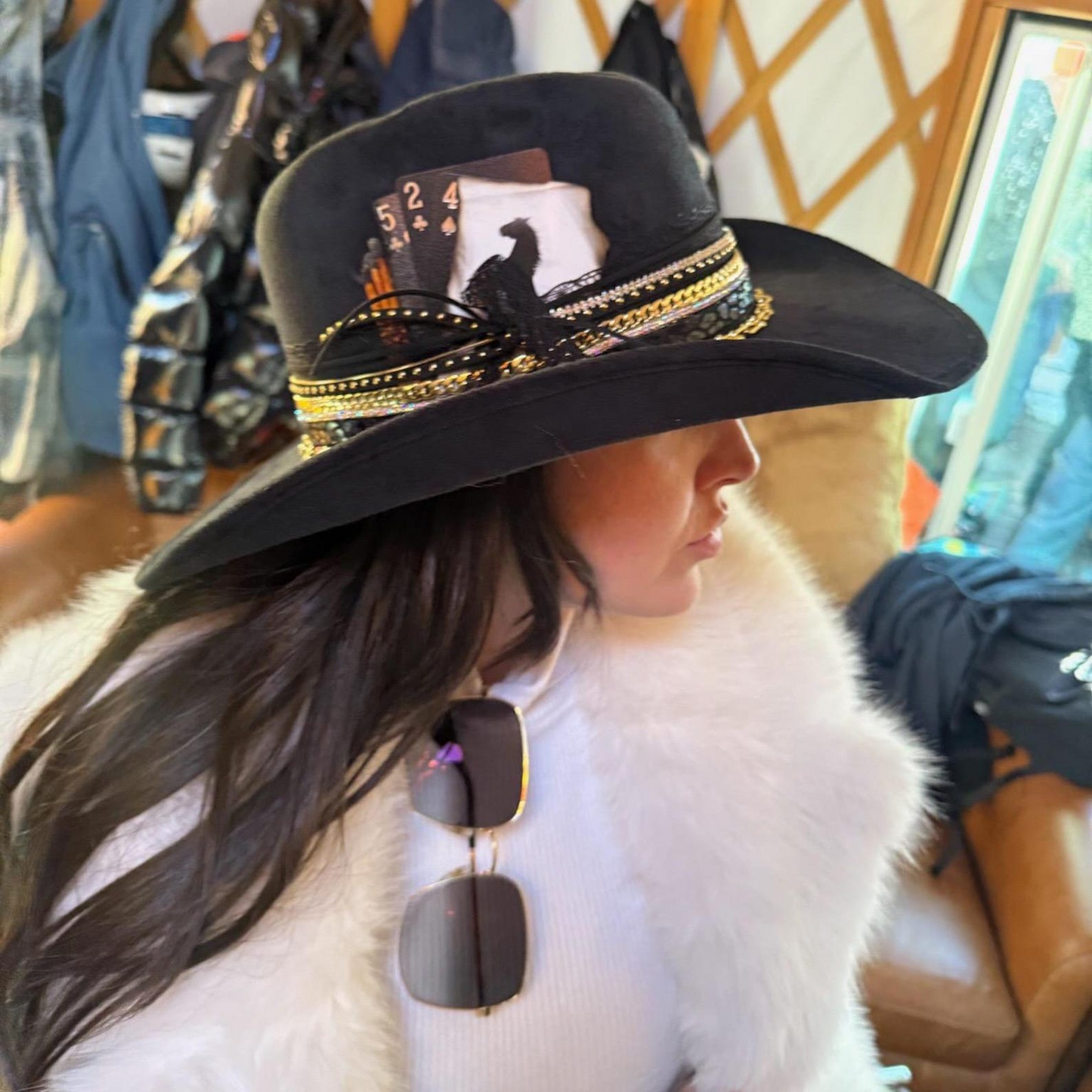Black cowboy hat with jeweled accents, western glam style, perfect for skiing, concerts, or travel, by Sunkissed by Chrissy.
