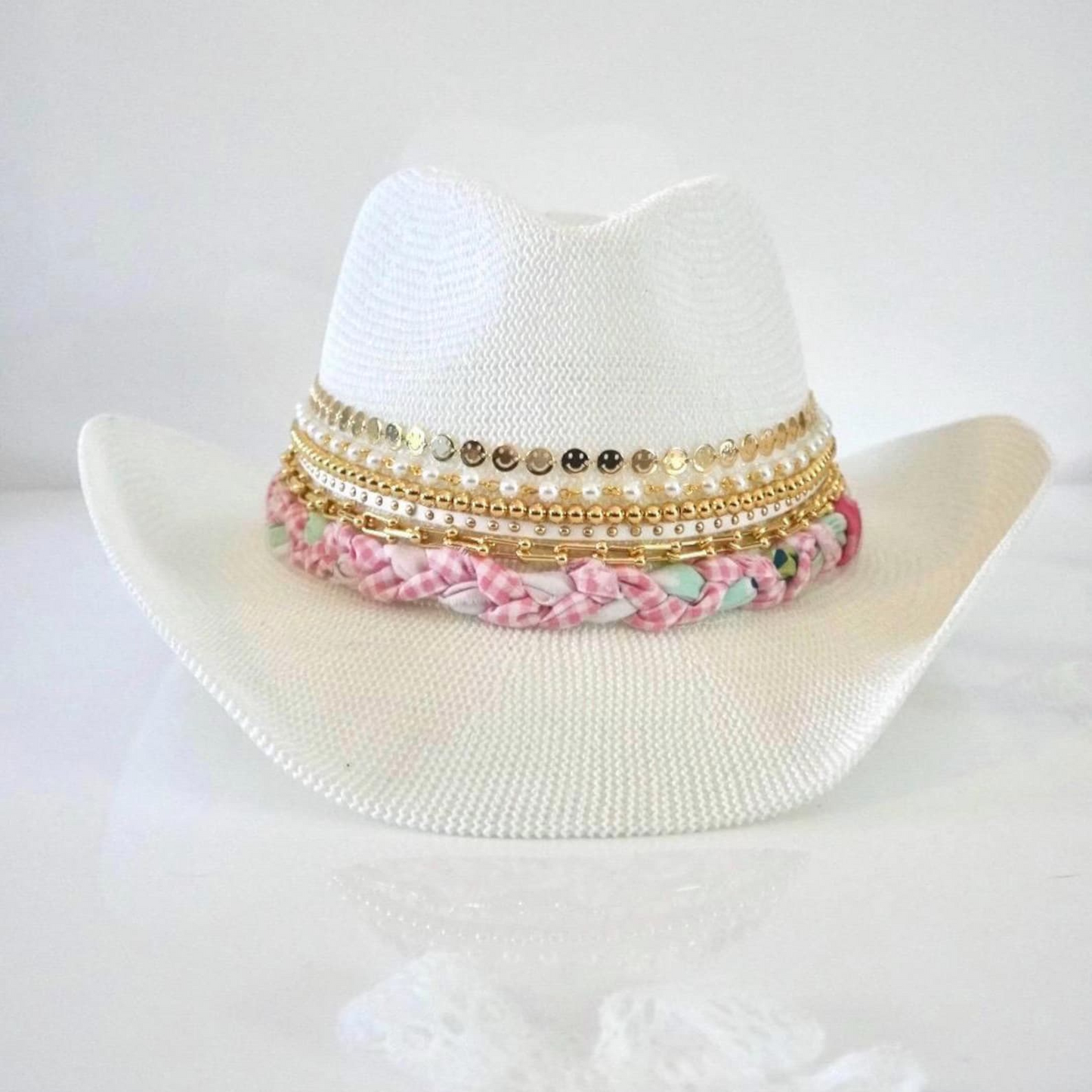 White cowboy hat by Sunkissed by Chrissy with jeweled bow embellishments, perfect for shabby chic or resort vacation style.