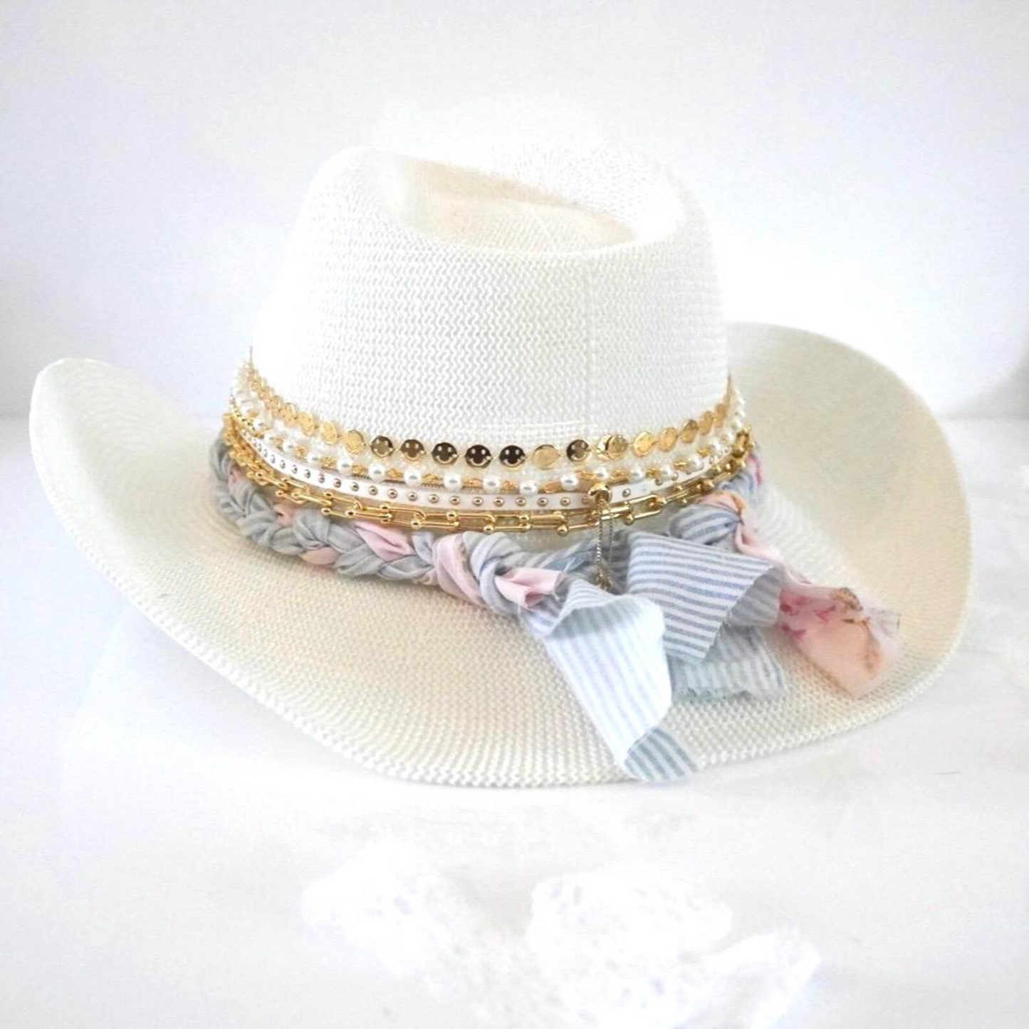 White cowboy hat by Sunkissed by Chrissy featuring a jeweled coquette bow, embellished details, perfect for shabby chic resort wear.
