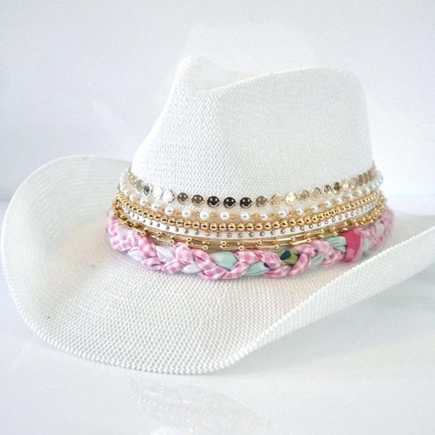 White cowboy hat by Sunkissed by Chrissy with jeweled bow embellishments, perfect for shabby chic cowgirl or resort vacation wear.