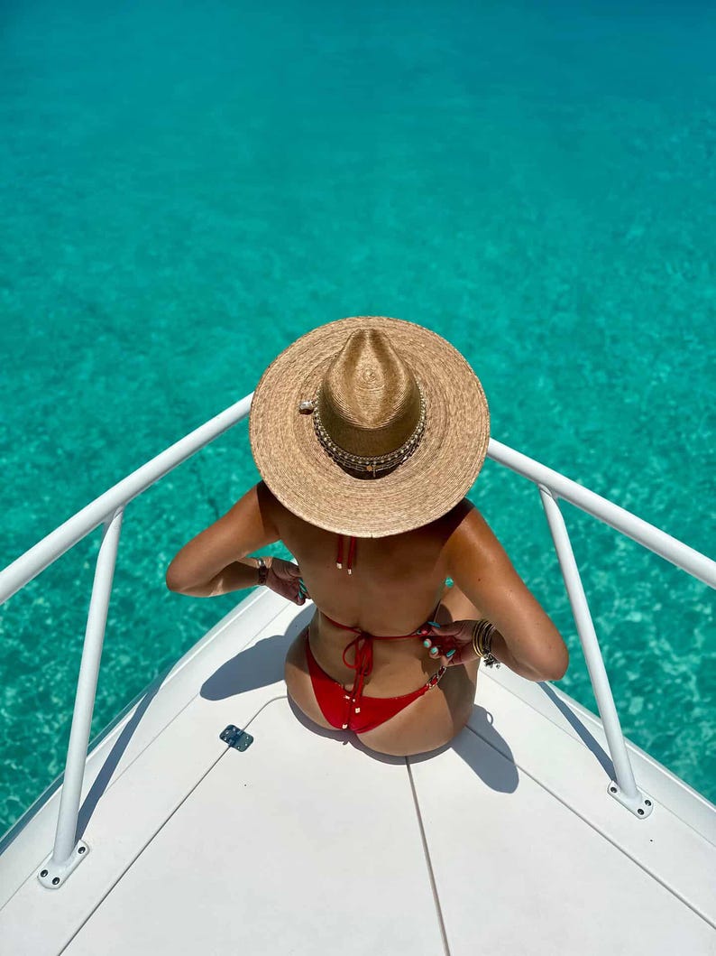 Wide brim Panama hat with shell accents by Sunkissed by Chrissy, perfect for beach resort and vacation wear.